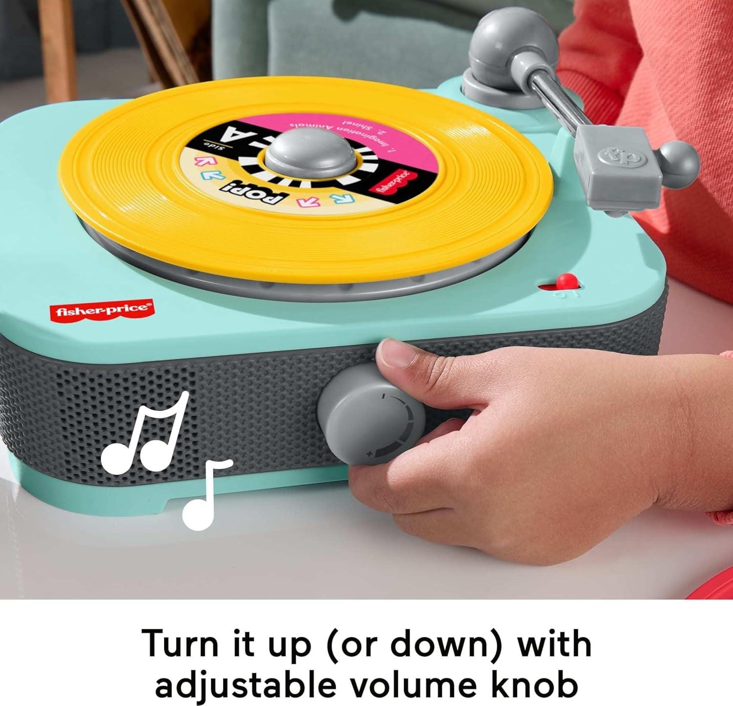 imageFisherPrice Musical Toy Deluxe Rockin Record Player Pretend Turntable with 6 Albums for Preschool Play Plus Bonus Exclusive Holiday Album Kids Ages 3 Years Amazon Exclusive