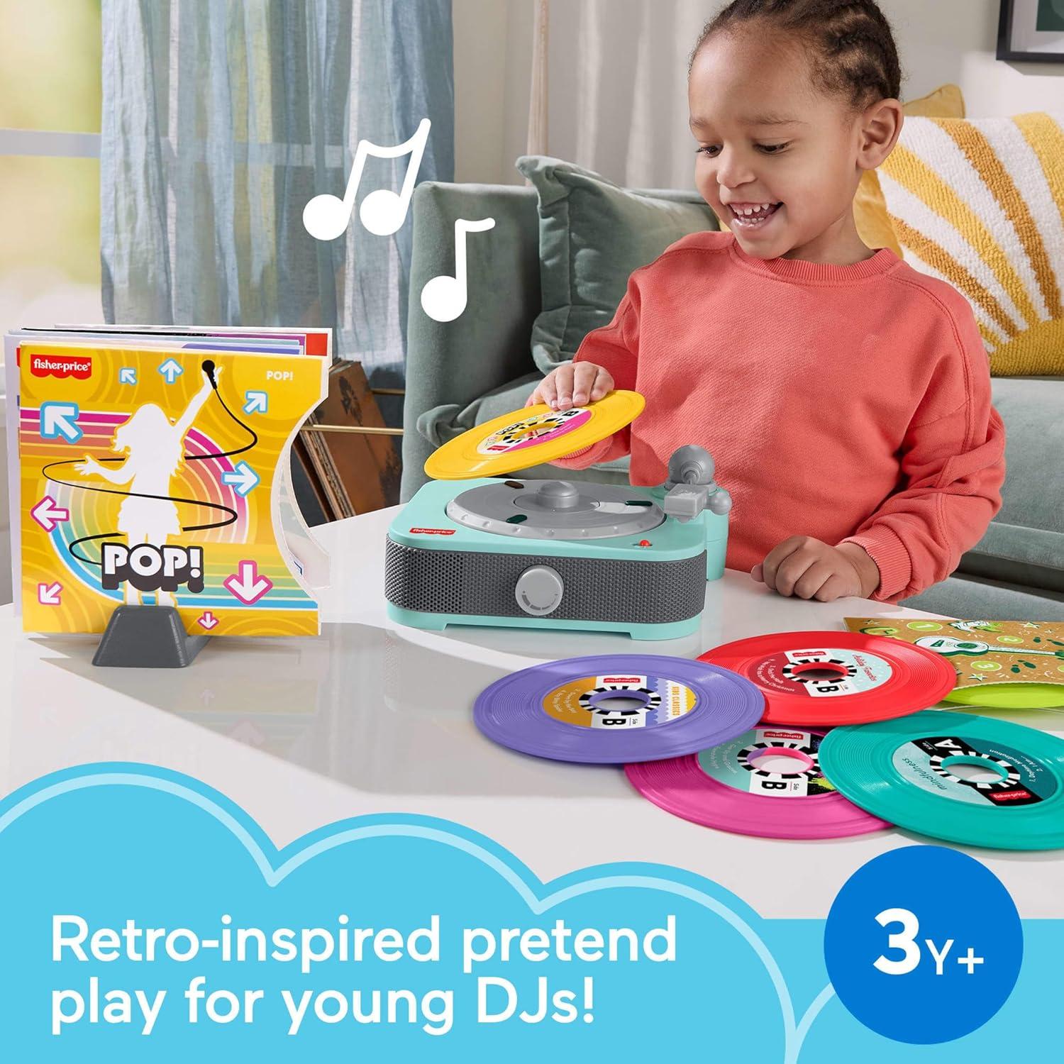 imageFisherPrice Musical Toy Deluxe Rockin Record Player Pretend Turntable with 6 Albums for Preschool Play Plus Bonus Exclusive Holiday Album Kids Ages 3 Years Amazon Exclusive