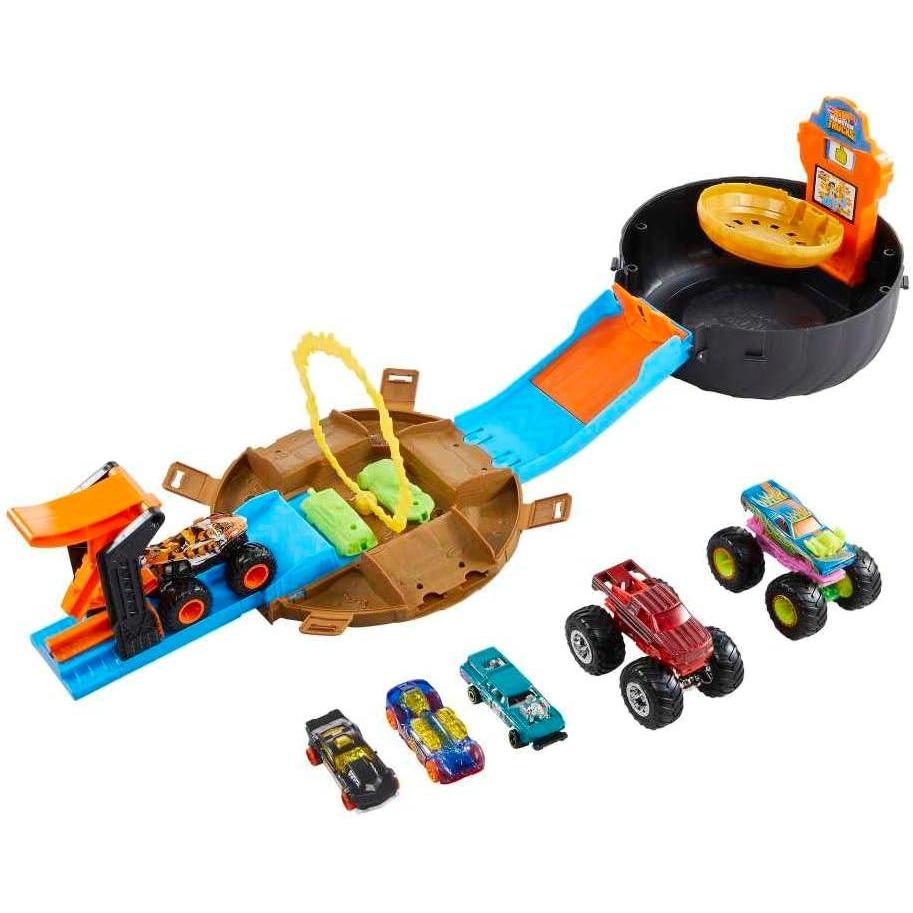 imageHot Wheels Toy Monster Trucks Playset TireShaped Case Transforms into Race Course 3 Trucks amp 4 Cars in 164 Scale Stunt Tire Amazon ExclusivePlayset