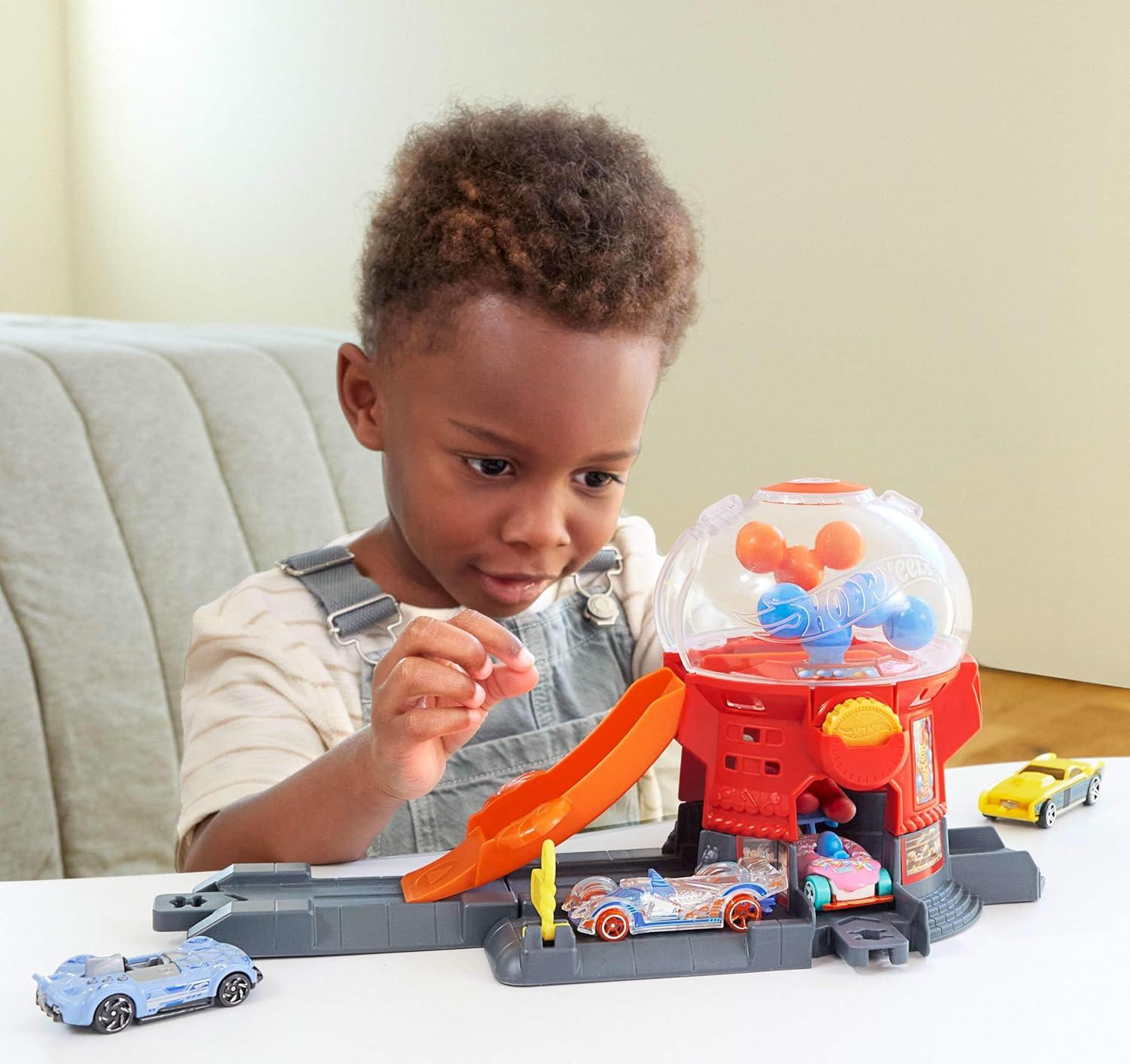 imageHot Wheels Toy Car Track Set Gumball Machine Playset with 164 Scale DieCast DonutShaped Vehicle amp Speed Snap Track Downtown City Candy Shop