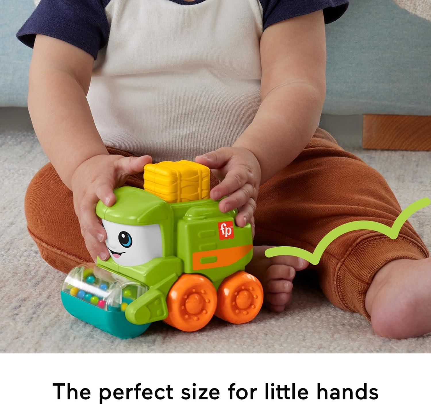 imageFisherPrice Baby Toy Rollin Tractor PushAlong Vehicle with Fine Motor Activities for Infants Ages 6 MonthsTractor