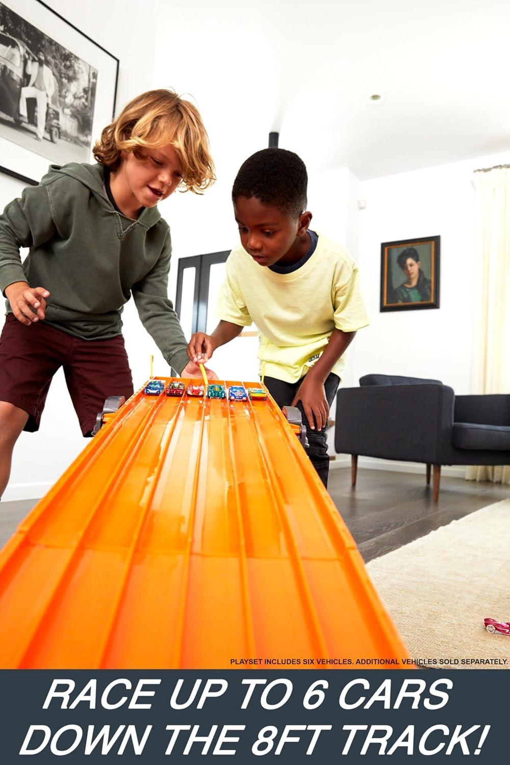 imageHot Wheels Toy Car Playset with Lights Sounds amp 6 164 Scale Vehicles Super 6Lane Raceway 8foot Track that Rolls Up for Storage Amazon ExclusiveRaceway