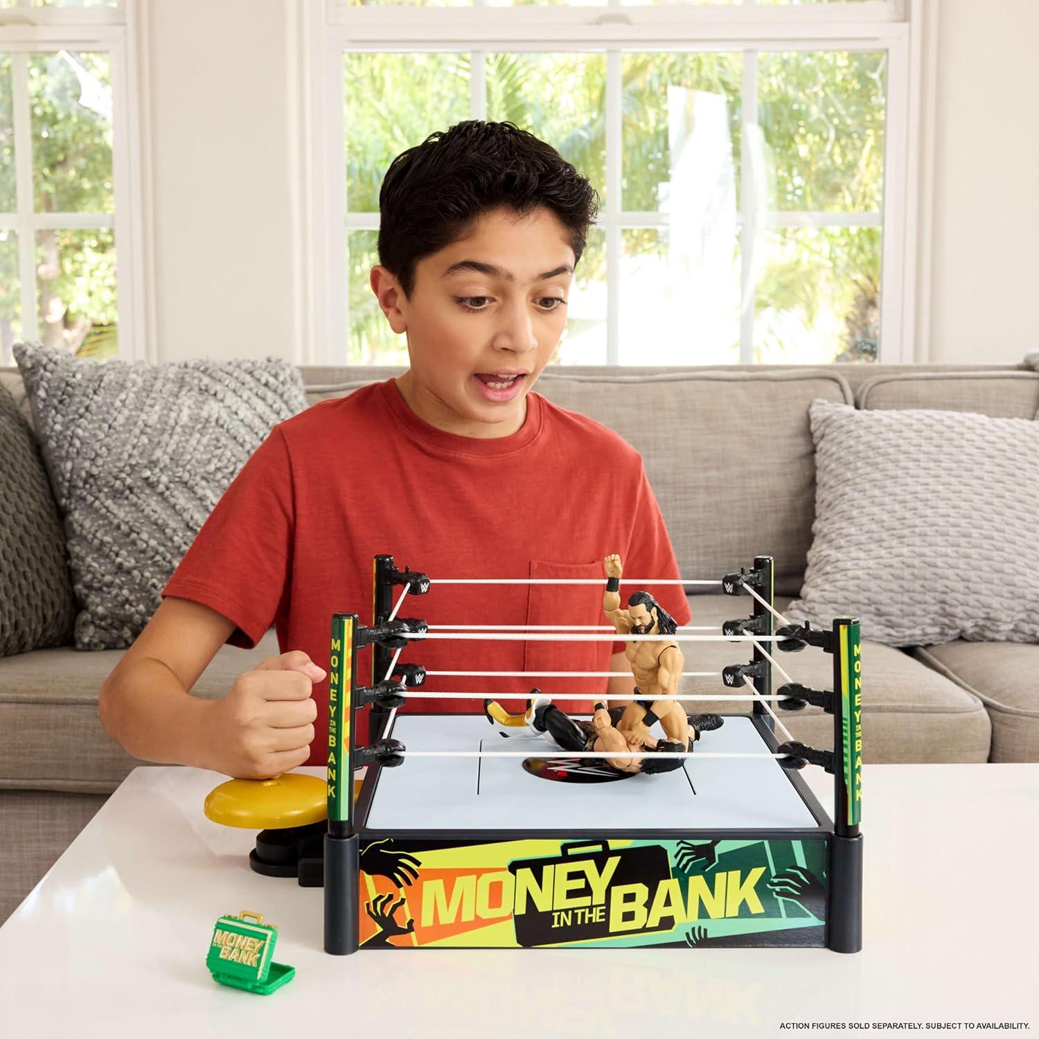 imageMattel WWE Money in The Bank Cashin Ring Playset with 2 Play Modes amp 40 Sounds amp Phrases Includes Launcher Crane Ladders amp Briefcase 13Inch x 20InchPlayset