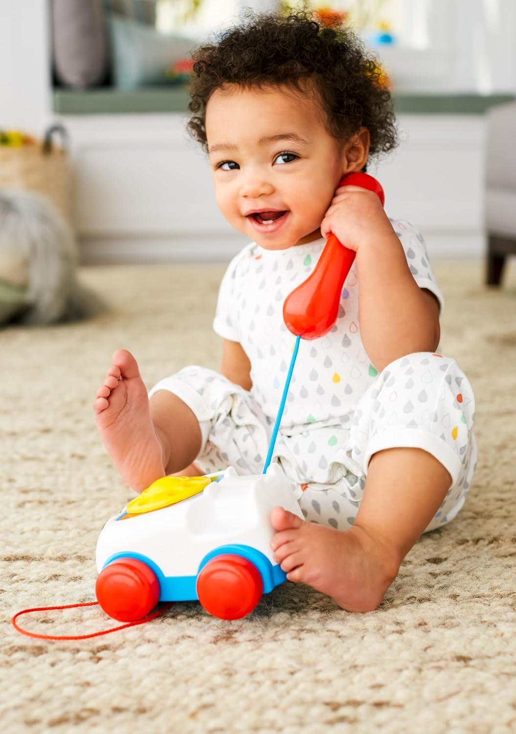 imageFisherPrice Toddler Pull Toy Chatter Telephone Pretend Phone with Rotary Dial and Wheels for Walking Play Ages 1 years
