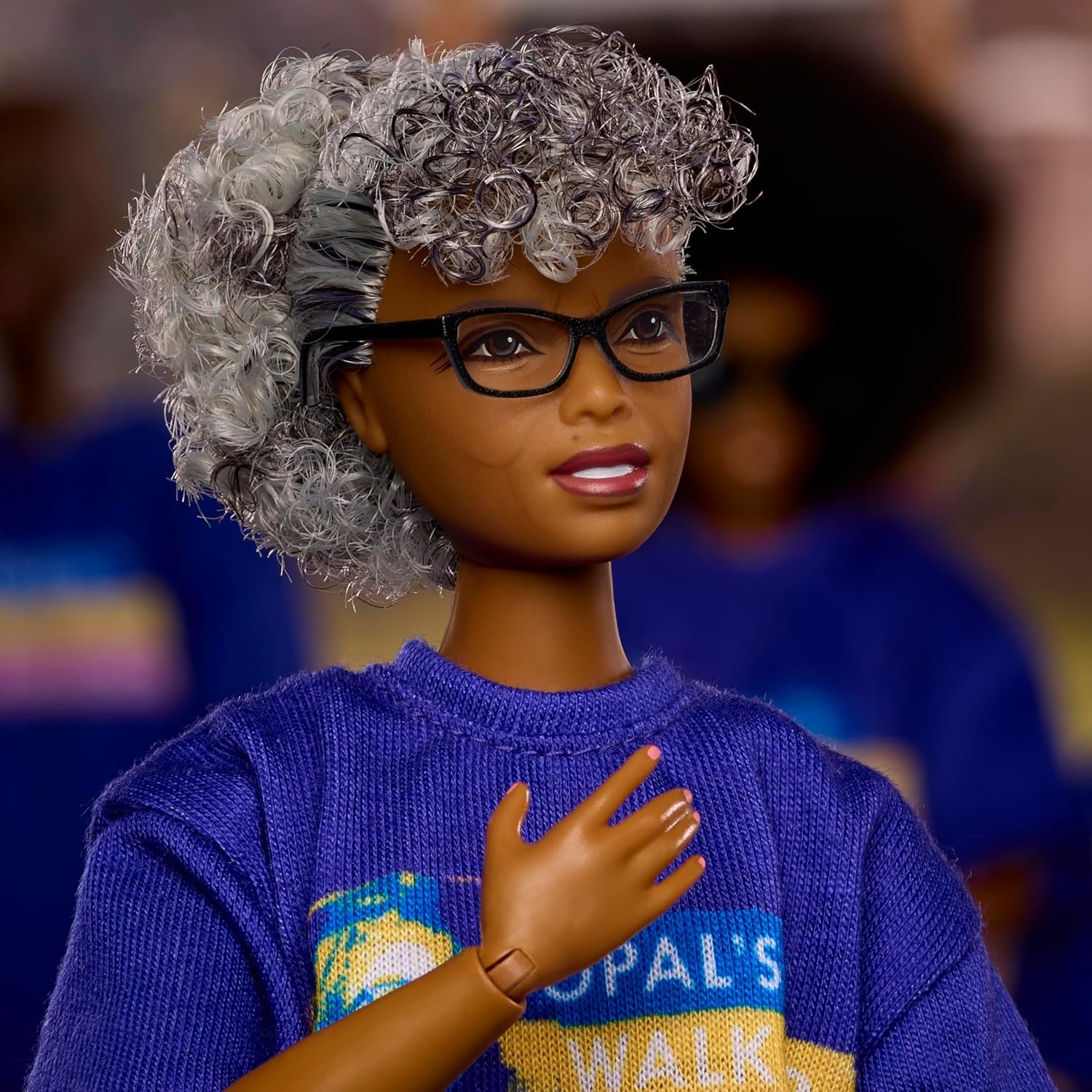 imageBarbie Inspiring Women Doll Opal Lee Collectible in Blue Opals Walk for Freedom TShirt White Pants and Glasses Doll Stand and Displayable Packaging