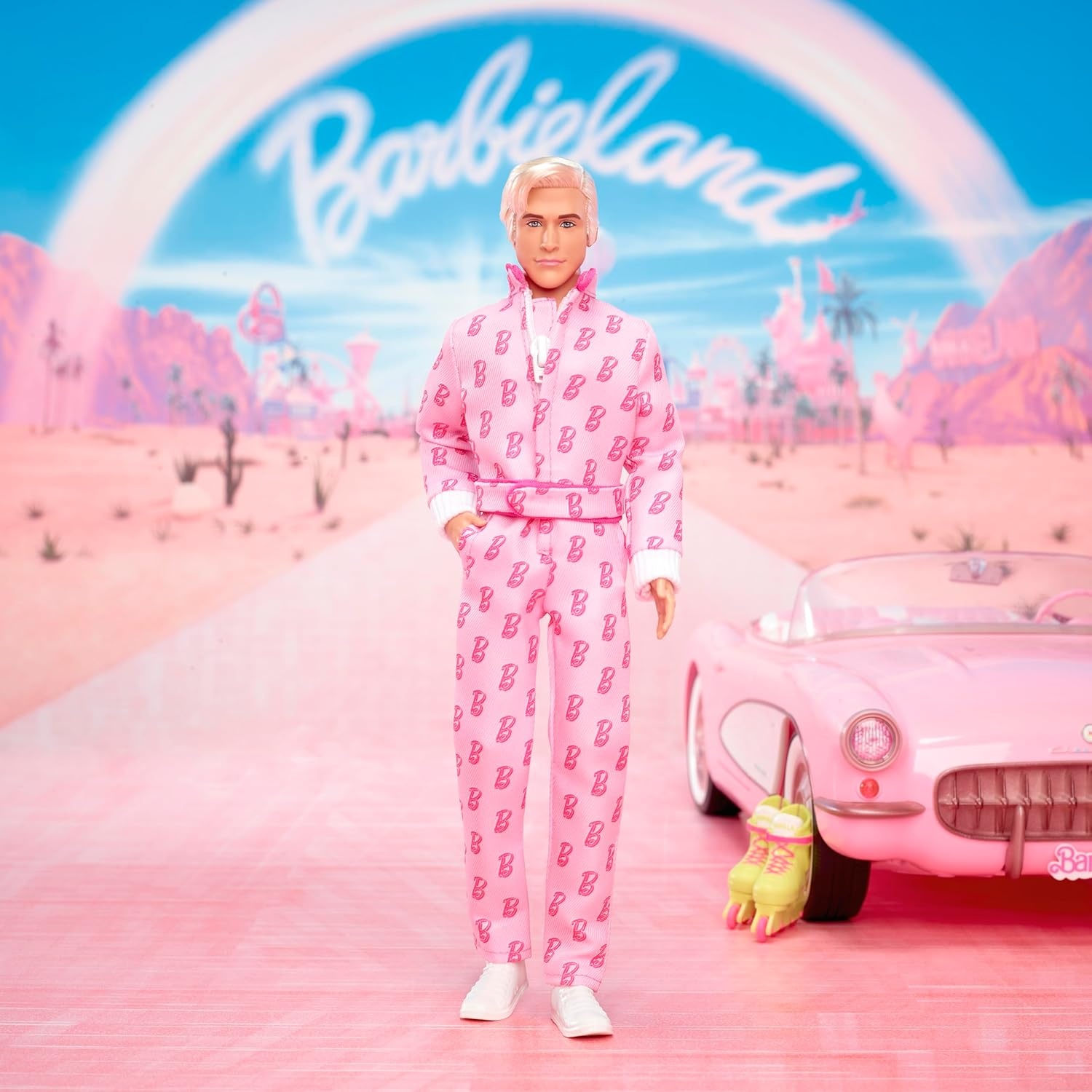 imageBarbie The Movie Ken Collectible Doll Ryan Gosling as Ken Wearing Pink Jumpsuit with B Detail with White Sneakers and Multicolor Roller Skates