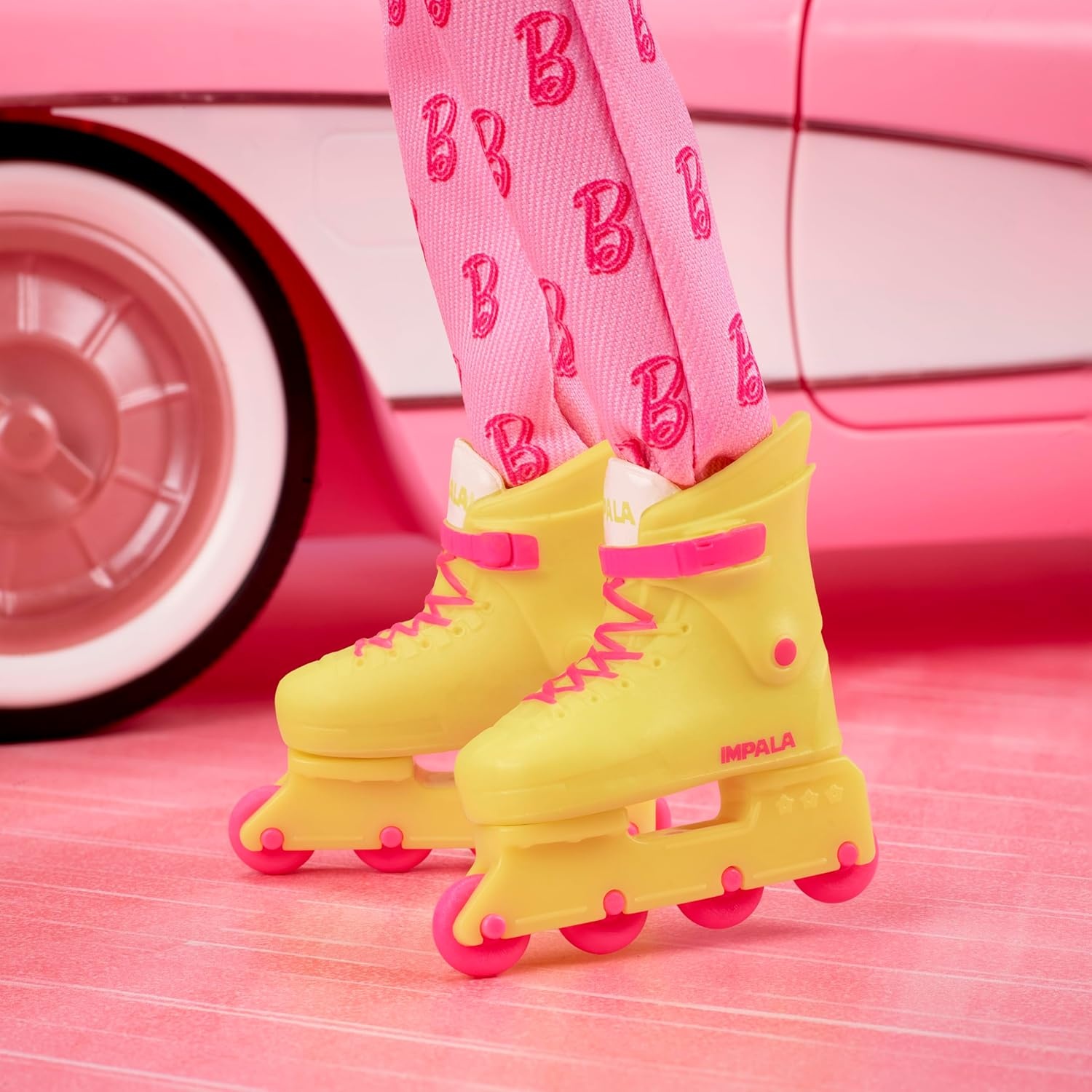 imageBarbie The Movie Ken Collectible Doll Ryan Gosling as Ken Wearing Pink Jumpsuit with B Detail with White Sneakers and Multicolor Roller Skates