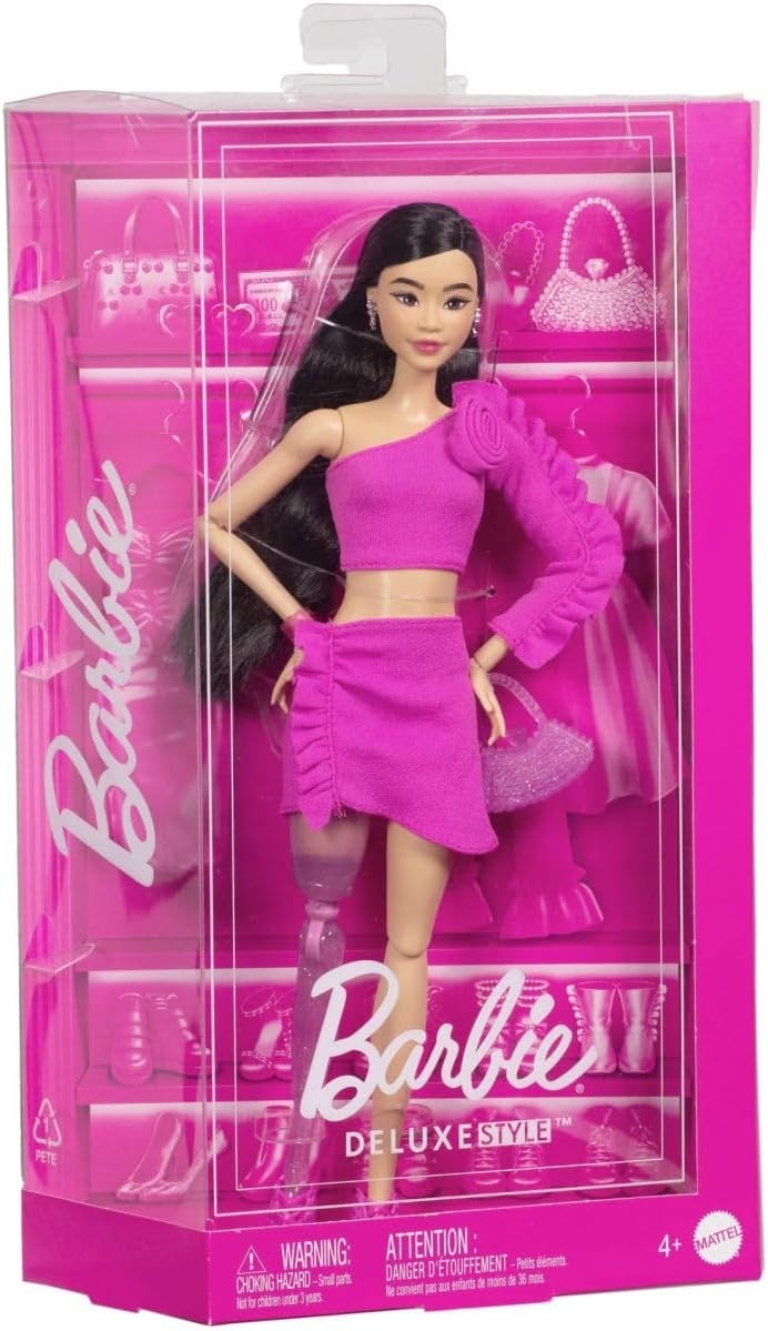 imageBarbie Deluxe Style Doll 2 in Barbiecore Outfit Black Hair and Glittery Prosthetic Leg Pink Top and Skirt Set with Rosette Detail and AccessoriesMulticolor