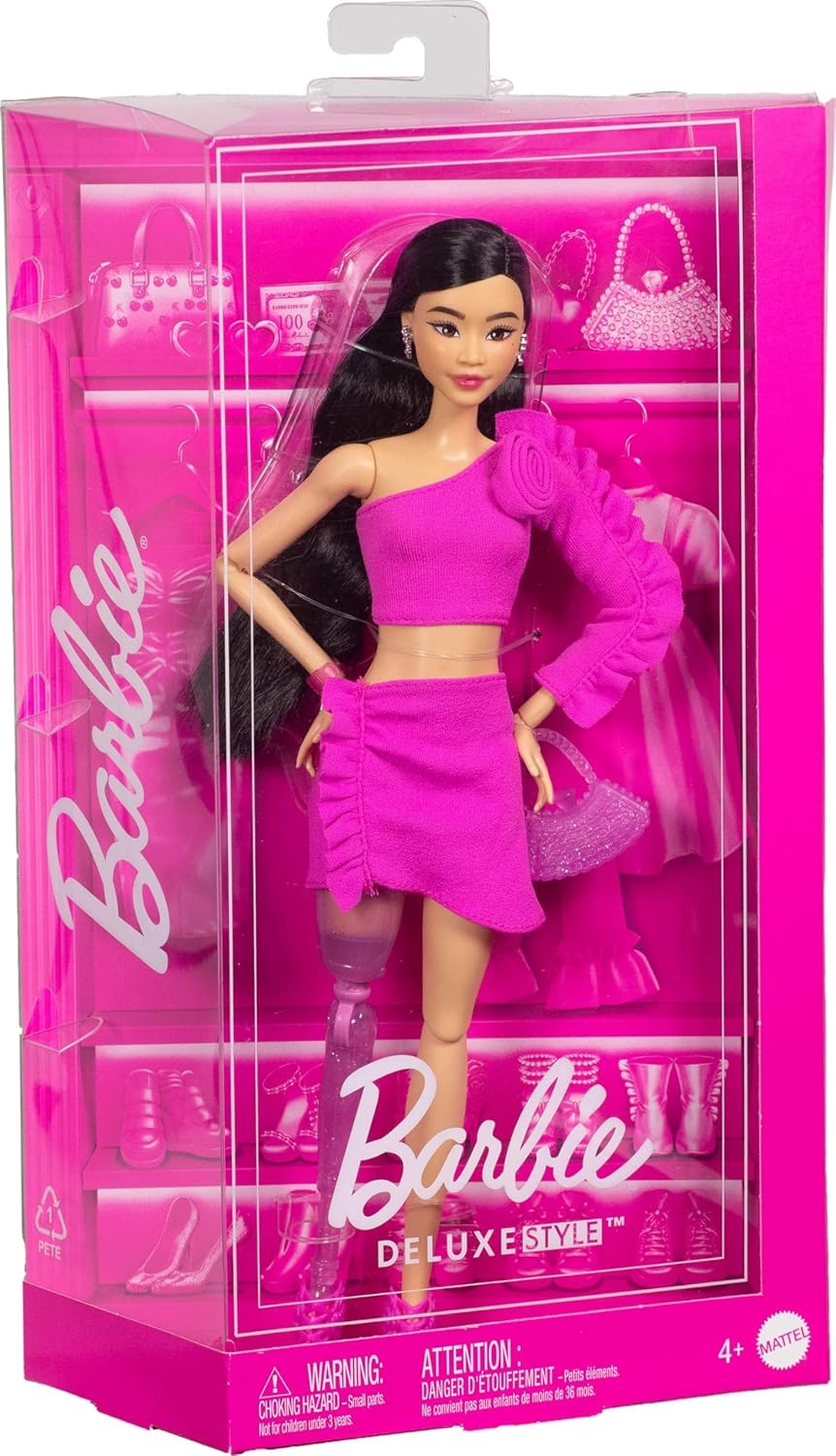 imageBarbie Deluxe Style Doll 2 in Barbiecore Outfit Black Hair and Glittery Prosthetic Leg Pink Top and Skirt Set with Rosette Detail and AccessoriesMulticolor